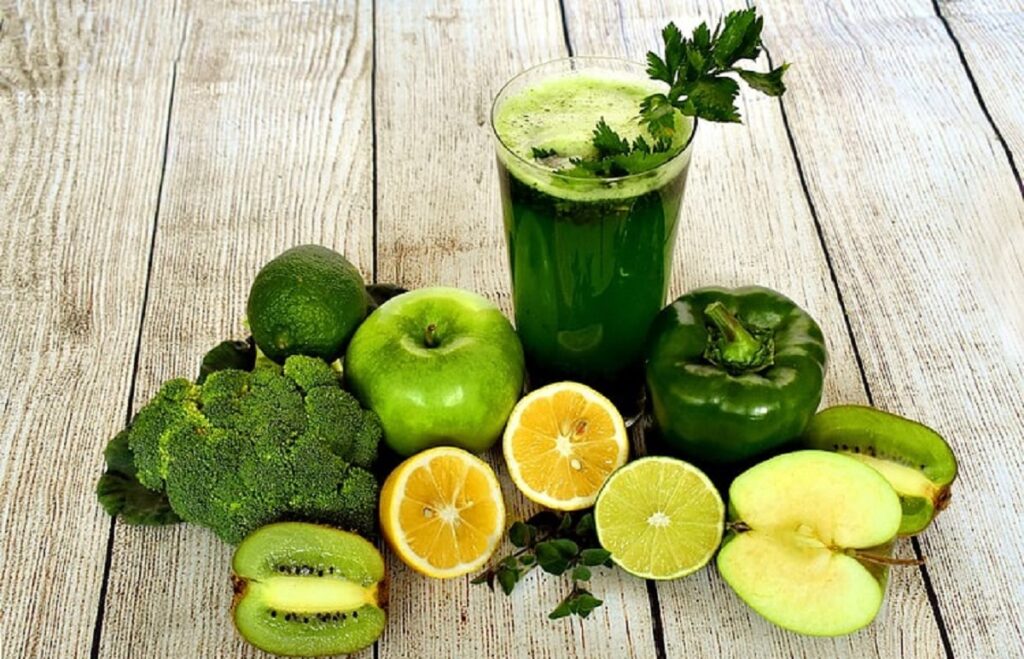 vegetables and juice on a table